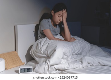 Anxiety disorder on insomnia woman concept, sleepless Woman open eye awakening on the bed at night time can't sleep from symptom of depression diseased. - Powered by Shutterstock