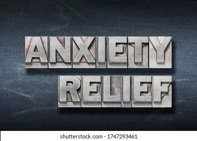 Anxiety Relief Phrase Made From Metallic Letterpress On Dark Jeans Background