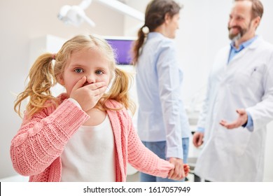 Anxious child at the dentist's mouth is closed - Powered by Shutterstock