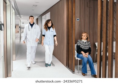 Anxious elderly woman awaiting her turn in a hospital waiting area. - Powered by Shutterstock