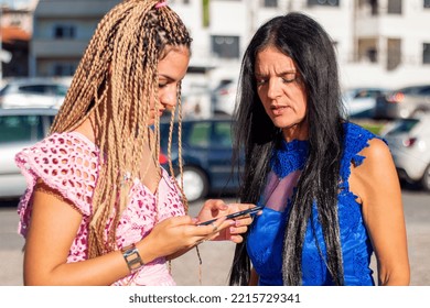 Anxious Mother Control  Her Teen Girl  Obsessed Addicted To Internet And Social Media, Cellphone Usage.Teen Ignoring Her Mom While Looking At Her Phone Or While Texting Messages