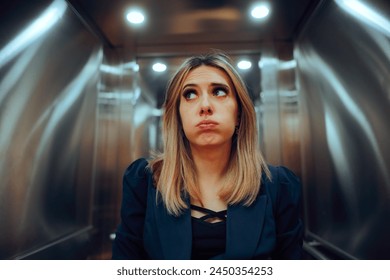 
Anxious Office Worker Riding an Elevator at the Workplace. Stressed businesswoman feeling trapped into a broke lift
 - Powered by Shutterstock