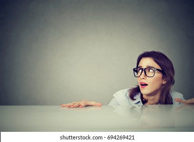 Anxious Woman Hiding Peeking From Under The Table 