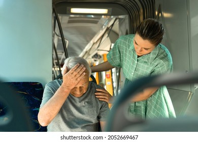 Anxious young woman and senior man is feeling sick with migraine symptoms in public transport - Powered by Shutterstock