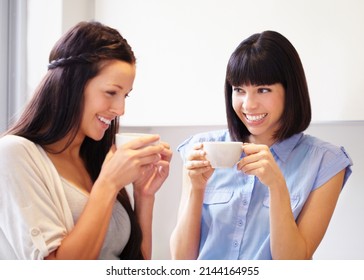 Anything Can Be Fixed By A Moment With Good Friend. Two Women Sharing An Enjoyable Moment In The Kitchen Over Coffee.