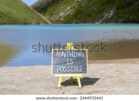 Anything is possible symbol. Concept words Anything is possible on beautiful black chalk blackboard. Beautiful mountain lake background. Business anything possible concept. Copy space.