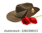Anzac Day army slouch hat with red poppy isolated on white background.