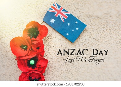 anzac day - Australian and New Zealand national public holiday, australian flag and poppy flowers memorial background		