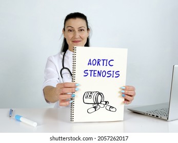 AORTIC STENOSIS phrase on the screen. Hematologist use cell technologies at office.