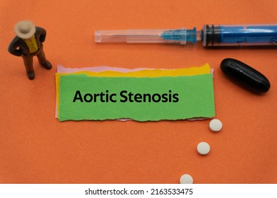Aortic Stenosis.The word is written on a slip of colored paper. health terms, health care words, medical terminology. wellness Buzzwords. disease acronyms.