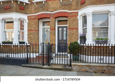 Apartament House With A White Arcade And Green Plants, London, UK