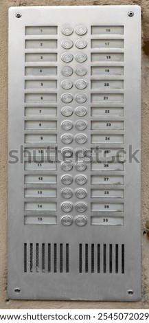 apartment building intercom system with thirty buttons to call apartments and people
