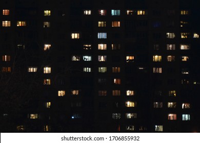 Apartment Building At Night. People Staying At Home