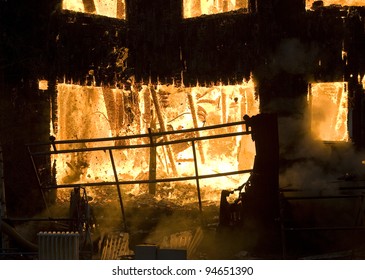 Apartment Building On Fire At Night Time