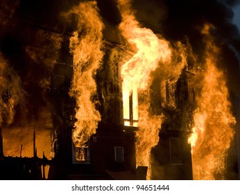 Apartment Building On Fire At Night Time