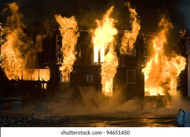 Apartment Building On Fire At Night Time