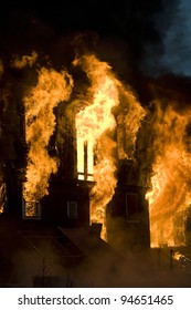 Apartment Building On Fire At Night Time