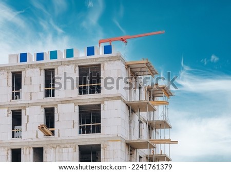 apartment building under construction on a sunny day 