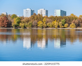 Apartment buildings above IOR or Titan park in Bucharest, Romania. Titan lake. - Shutterstock ID 2259115775