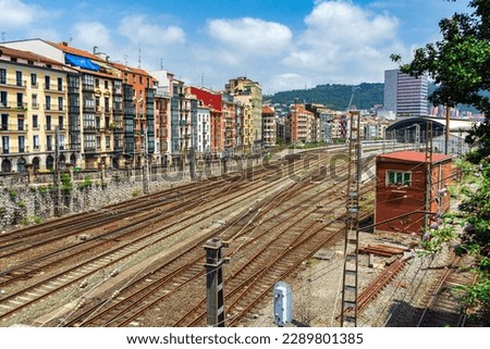 Apartment buildings located near a major railway junction. Railway rails near a residential area, Bilbao, Spain.