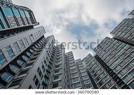 Apartment buildings in residential area, Hong Kong. Blue sky as background with copy space.