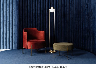 Apartment with comfortable red velour armchair, minimalist floor lamp and green pouf or ottoman in living room with dark blue velvet wall panels and floor carpeting. Concept of luxury interior design