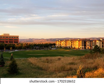 Apartment complex in Broomfield, Colorado during golden hour with Rocky mountains in the background