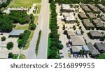 Apartment complex in mixed-use development area along Keller Parkway, Farm to Market Road 1709 with commercial building, restaurants, residential houses in Keller, Texas, suburbs Dallas, aerial. USA