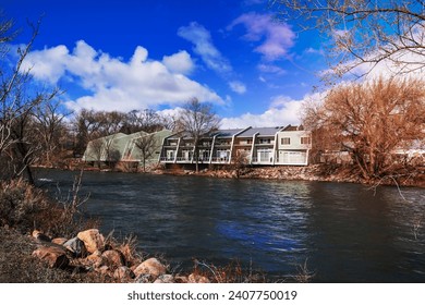 Apartment complex on the shoreline of Truckee River, Reno, Nevada; increased water level due to snow melt