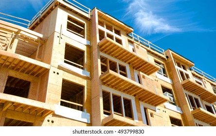 Apartment Condominium Complex, Wood Frame Construction, Victoria, Canada.  Blue Sky Background