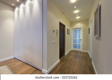 Apartment Corridor With Brown Floor

