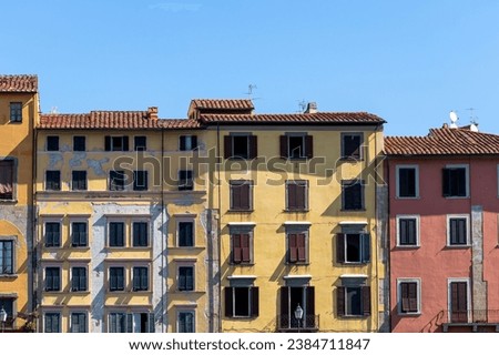 Apartment houses in Pisa, Italy. Derelict condition with plaster coming off