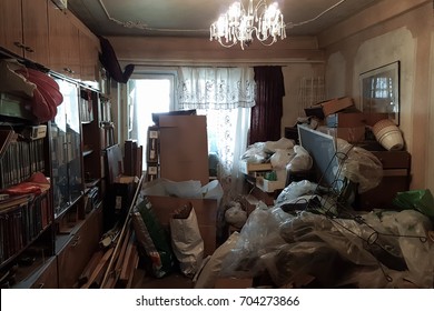 Apartment of a pensioner who suffers from compulsive hoarding, littered with trash and books - Shutterstock ID 704273866
