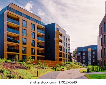 Apartment in residential building exterior. Housing structure at blue modern house of Europe. Rental home in city district on summer. Wall and glass high architecture for business property - Shutterstock ID 1731270640