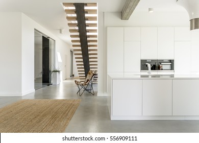 Apartment With White Open Kitchen And Stairs