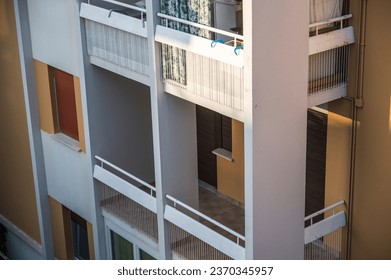 Apartment windows, doors, balcony and railing in the sun