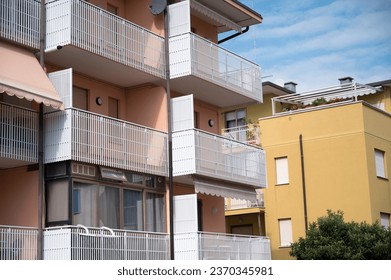Apartment windows, doors, balcony and railing in the sun
