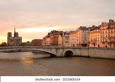 Apartments On Ile Saint Louis, Notre Dame Cathedral On Ile De La Cite And Pont De La Tournelle Over Seine River, Paris, France