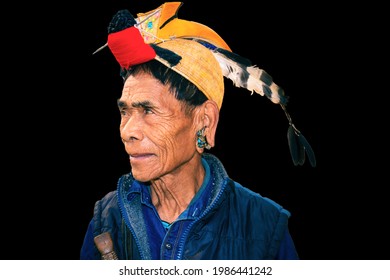 apatani tribal men facial expression with his traditional hat from flat angle image is taken at ziro arunachal pradesh india. it is one of the oldest tribe of india.