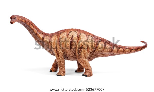 白い背景に切り取り線とアパトサウルスのおもちゃ。ジュラ紀後期。