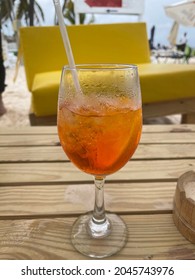 Aperil Spritz Drink On Table Against Punta Cana Beach