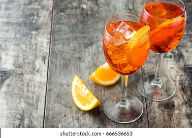 Aperol spritz cocktail in glass on wooden table
