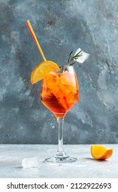 Aperol Spritz Cocktail. Italian Cocktail With Bloody Oranges, Red Bitter, Dry White Wine, Soda, Zest And Ice. Freeze Motion In Jar Glass.