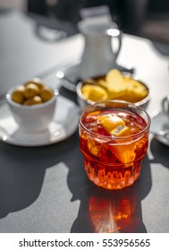 Aperol Spritz Cocktail With Olive And Orange Piece As It Can Be Served In Padua, Italy.