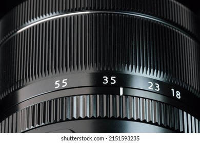 Aperture and distance rings on the camera lens full screen close-up