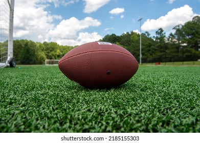 Apex, NC 083022 Football Sits On High School Field Waiting For Spring Training To Begin.