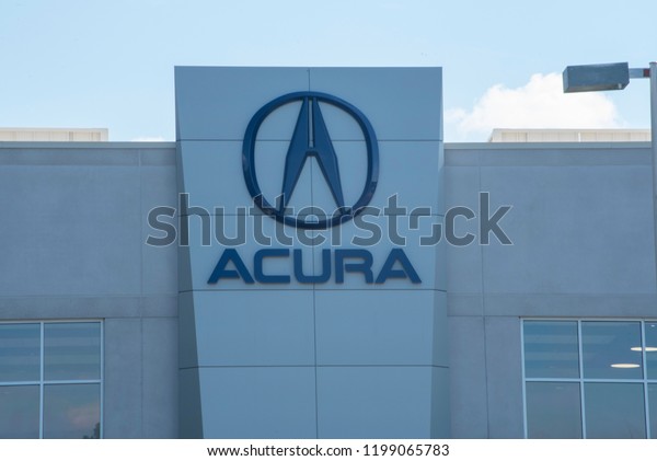 Apex, NC/United States- 09/29/2018:\
The Acura logo is seen in front of a corporate\
dealership.