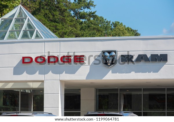 Apex, NC/United States- 09/29/2018: The Dodge\
logo is seen in front of a\
dealership.