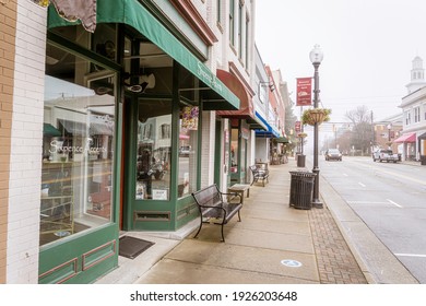 Apex, North Carolina USA-02 27 2021: Looking Down the Downtown Apex Sidewalk on a Very Foggy Day.