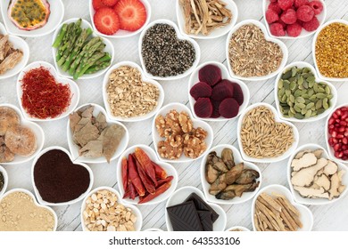 Aphrodisiac food selection for good sexual health over white distressed wood background.
